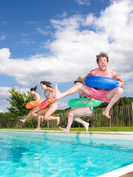 people jumping into pool