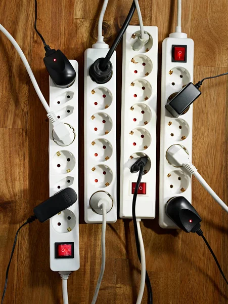 Electrical plugs on a wooden floor