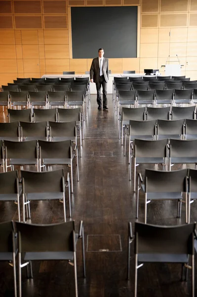 Businessman in empty conference room