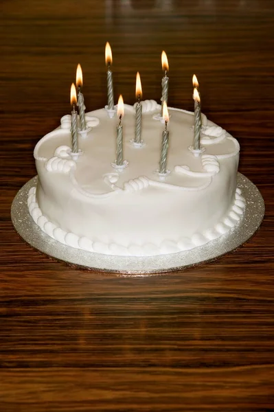 Birthday cake on dining table — Stock Photo, Image