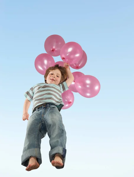 Niño Saltando Con Montón Globos —  Fotos de Stock