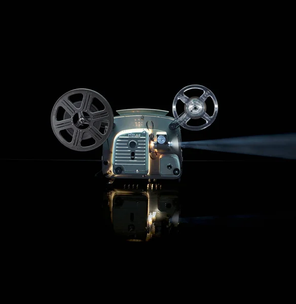 Glowing movie projector with reel — 스톡 사진
