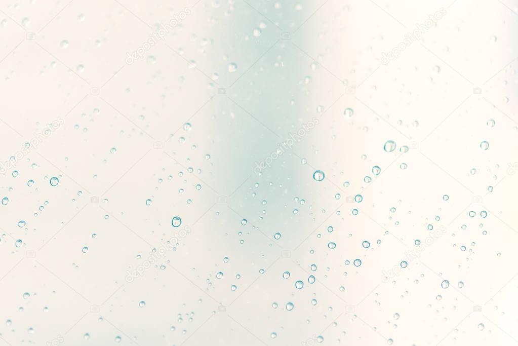 Rain drops on abstract pastel background