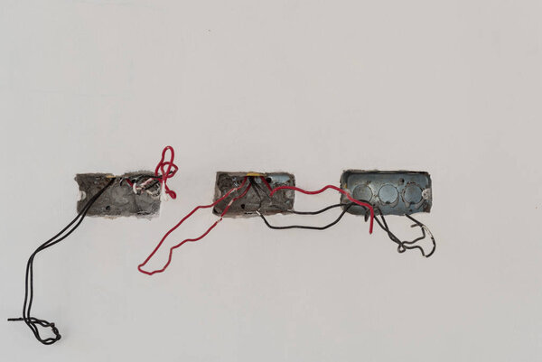 wire  socket install on white cement wall