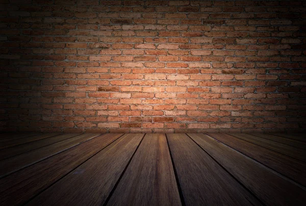 Grunge room with wooden floor and red brick wall background — Stock Photo, Image