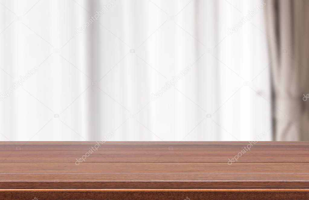 Wood table top with modern white curtain room background