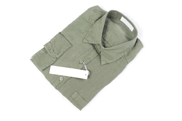 Top view,New trendy green linen shirt with label isolated on whi — Stock Photo, Image