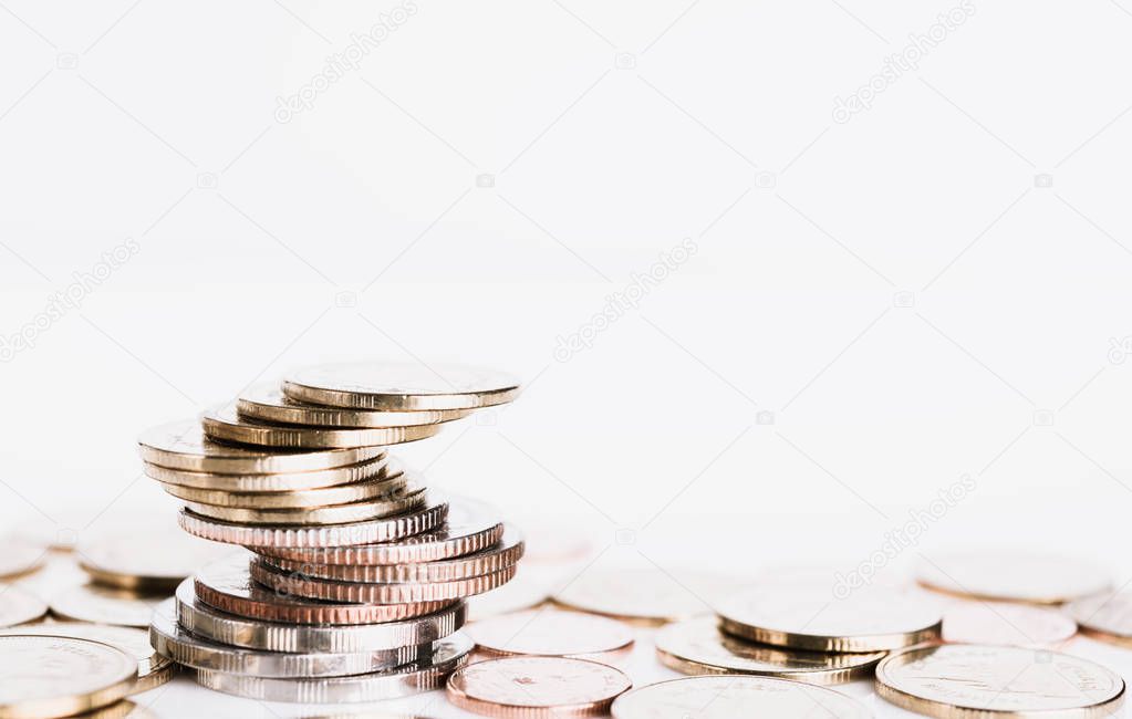Golden money coins on  white  background