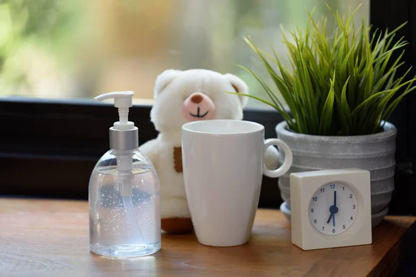 Hand Sanitizer White Cup Teddy Bear Alarm Clock Wood Table — Stock Photo, Image