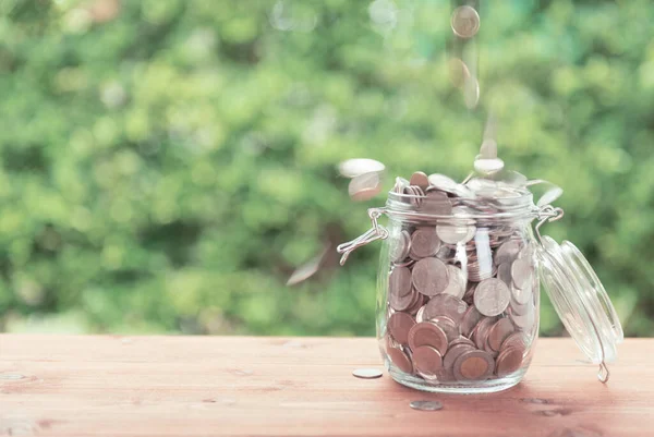 Money Coins Falling Glass Jar Old Wooden Table Green Nature — Stock Photo, Image