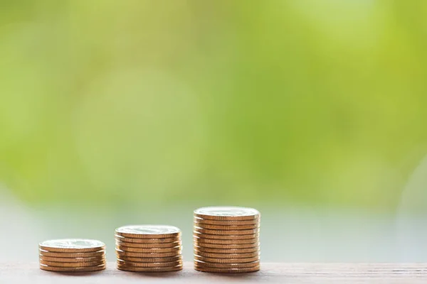 Golden Coins Wooden Table Green Blurred Background Saving Money Concept — Stock Photo, Image