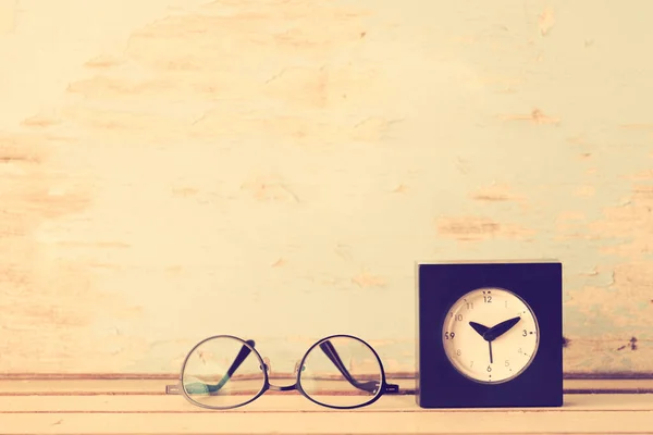 Glasses Black Clock Wooden Table Retro Filter Image — Stock Photo, Image