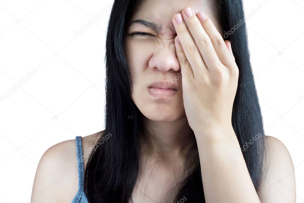 Eyes pain and eyes strain in a woman isolated on white background. Clipping path on white background.