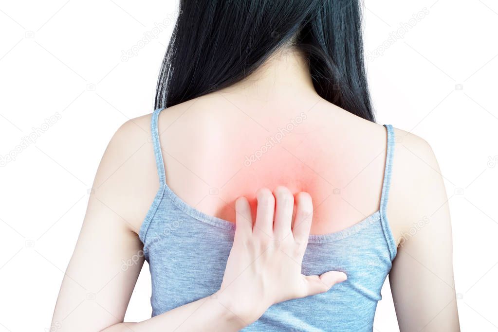 Scratching her back in a woman isolated on white background. Clipping path on white background.