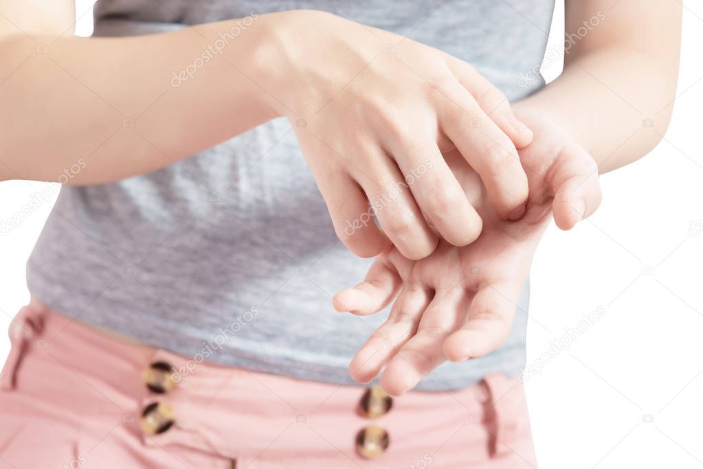 Scratching her hand in a woman isolated on white background. Clipping path on white background.