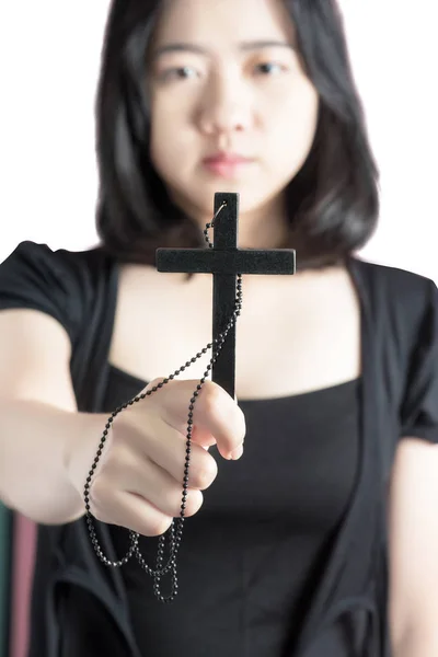 Beautiful asia woman with hopeful holding christian symbol of crucifix praying to God isolated on white background. Clipping path on white background. — Stock Photo, Image