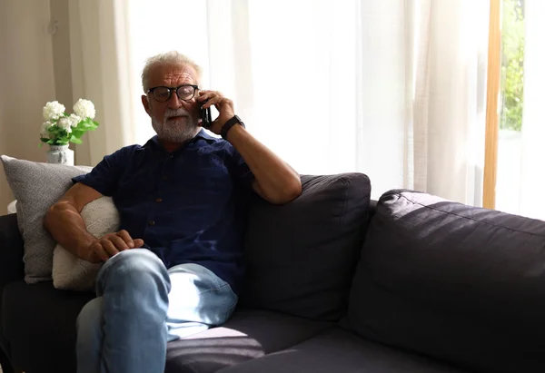 Senior Man Sitting Alone Relaxation Talking Smart Phone Home — 스톡 사진