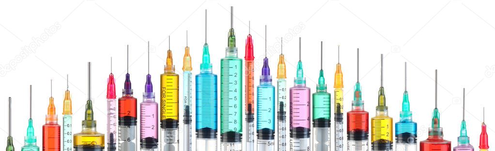 Bright and colorful syringes isolated on white