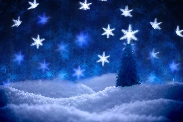 Single tree in snow surrounded by a bokeh of glittering lights i — Stock Photo, Image