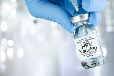 Mavi eldivenli sağlık konsepti HPV, insan papillomavirus, aşı şişesi