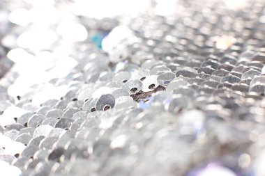 Parlak pullar ve ışıltıların ışıltılı tatil makro arka planı