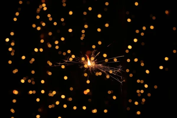 Burning Sparkling Sparkler New Year Festive Bokeh Background — Stock Photo, Image