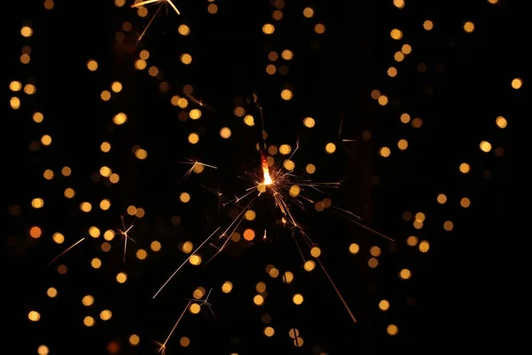 Burning Sparkling Sparkler New Year Festive Bokeh Background — Stock Photo, Image