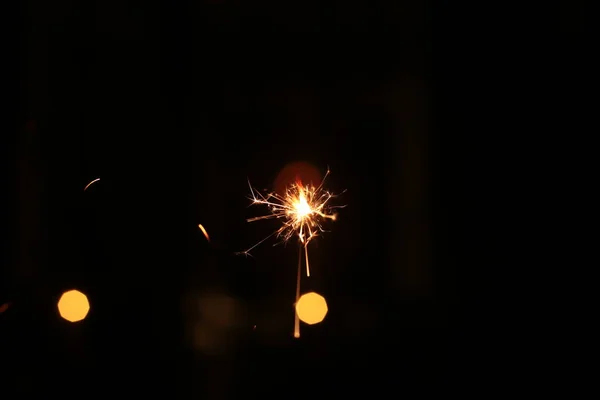 Burning Sparkling Sparkler New Year Festive Bokeh Background — Stock Photo, Image