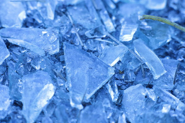 Small blue glass fragments, macroice pieces background