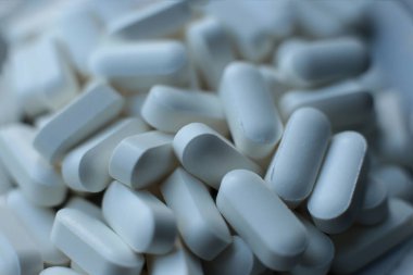 Beslenme takviyeleri. Sağlıklı haplar. Makro görünüm tıbbi geçmiş.