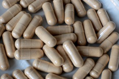 Beslenme takviyeleri. Sağlıklı haplar. Makro görünüm tıbbi geçmiş.