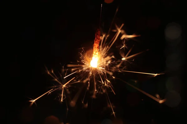 festive burning sparkler macro photo