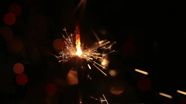 festive burning sparkler macro photo