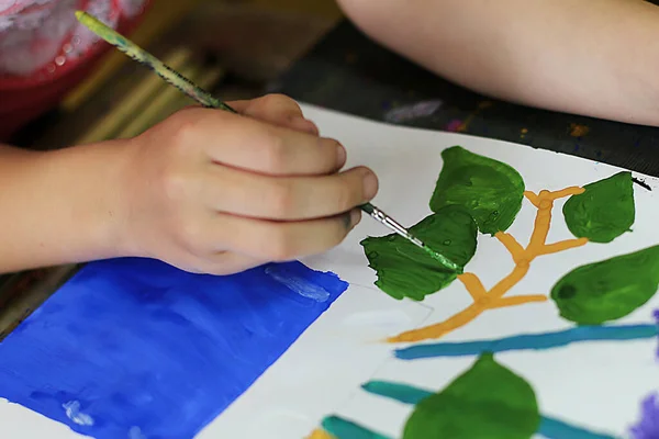 a lesson in an art school for children on paint, modeling and application, future artists create masterpieces