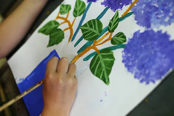 a lesson in an art school for children on paint, modeling and application, future artists create masterpieces