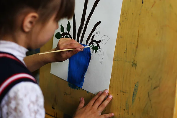 a lesson in an art school for children on paint, modeling and application, future artists create masterpieces