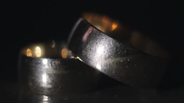 Wedding Rings Stacked on a Dark Background — Stock Video