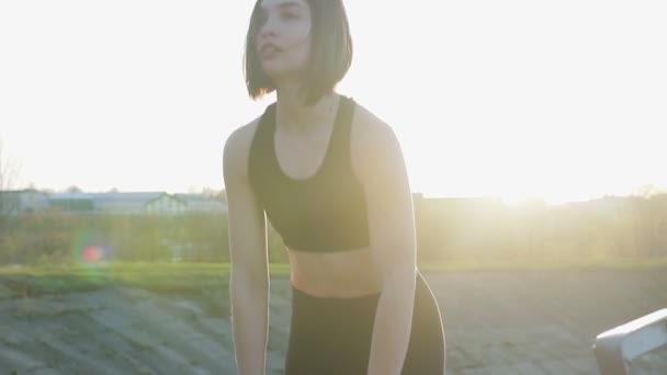 Young cute girl doing exercises with her hands on the stairs — Stock Video