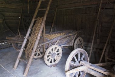 May 8, 2019 Tallinn city of Estonia. Ethnographic Museum in the open air. antique cart with straw on wooden wheels  