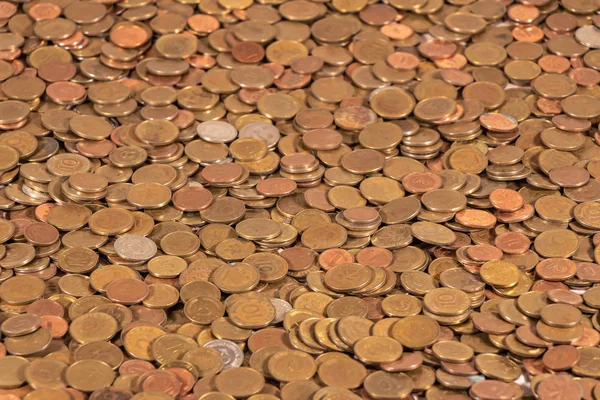 Thousands of golden, silver and copper coins