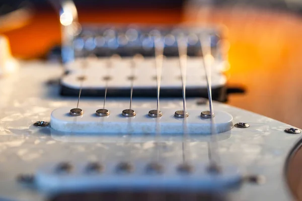 perspective view of electric guitar pickups and strings