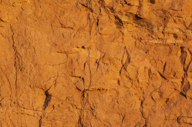 Toprağın parlak turuncu yüzeyi kum, arkaplan, doku
