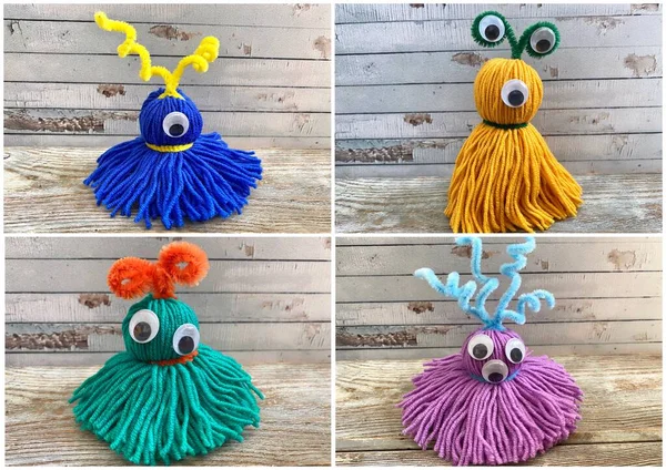 4 bunte, lustige Monster mit lustigen Augen aus Garn, Kinderbasteln — Stockfoto