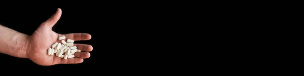 Знамя Горсткой Белых Таблеток Витамины Левой Руке Черном Фоне Благослови — стоковое фото