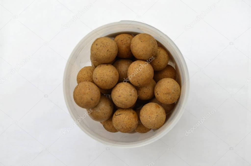 Isolated Pot of Round Brown Carp Fishing Boilies Bait