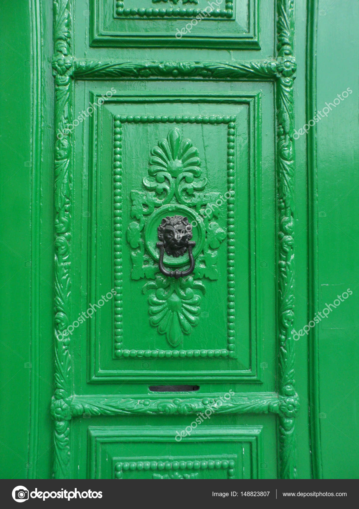 Ornate Green Door With Lion Door Knocker Stock Photo