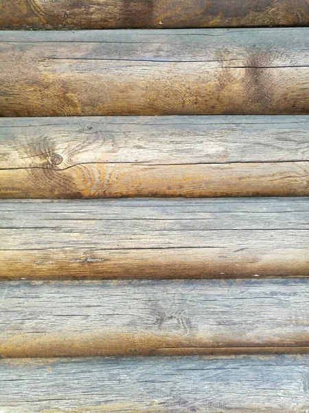 Tekstura Drewnianej Ściany Wyłożonej Okrągłymi Kłodami Ściśle Siebie Przymocowana — Zdjęcie stockowe