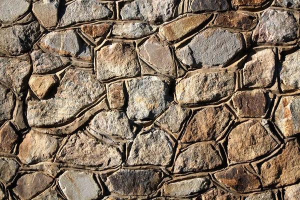 Background Wall Made Natural Stone Different Sizes Sunny Day — Stock Photo, Image