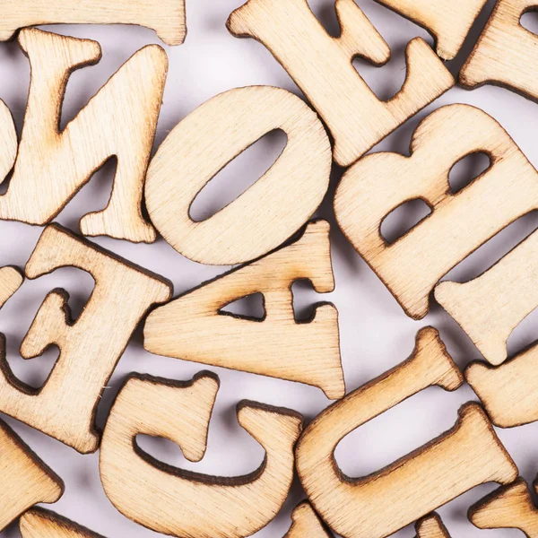 Surface covered with wooden letters