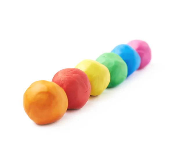 Plasticine ballen geïsoleerd rijtje — Stockfoto